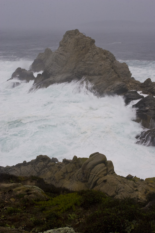 Waves Breaking Against Rocks